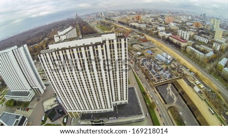 MOSCOW - OCT 21: Cityscape with tall multistorey Hotels Vega in Izmailovo with car parking and long road (view from unmanned quadrocopter) on October 21, 2013 in Moscow, Russia.