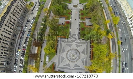 MOSCOW - OCT 10: Green recreation area on Kudrinskaya Square with benches near commerce building and highway (view from unmanned quadrocopter) on October 19, 2013 in Moscow, Russia.