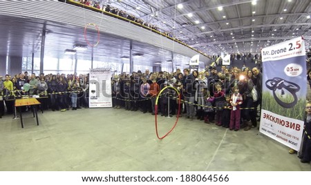 RUSSIA, MOSCOW - JAN 25, 2014: view to people looking  at drone presentation on Geek Picnic. Is largest European festival of modern technology, science and art.