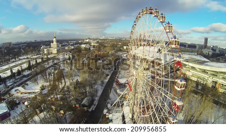 MOSCOW, RUSSIA - NOVEMBER 30, 2013: Amusement park and the Central Pavilion in Russia Exhibition Center, aerial view. The park was created in 1995 for the 850 anniversary of Moscow