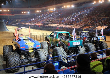 MOSCOW, RUSSIA - MAR 29, 2014: Big jeeps with huge wheels at show Monster X Tour in Olympic Sports Complex