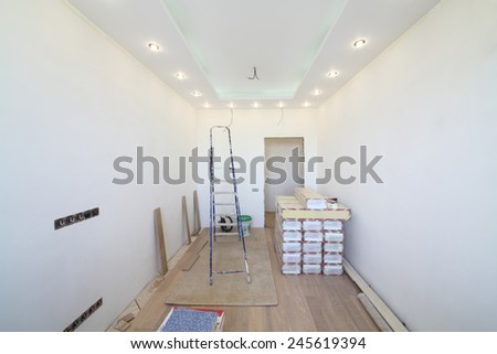 Empty room where there is a repair with tool and building material