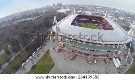 MOSCOW, RUSSIA - MAR 30, 2014: Cityscape with people walk away from Locomotive sports stadium at spring day. Aerial view