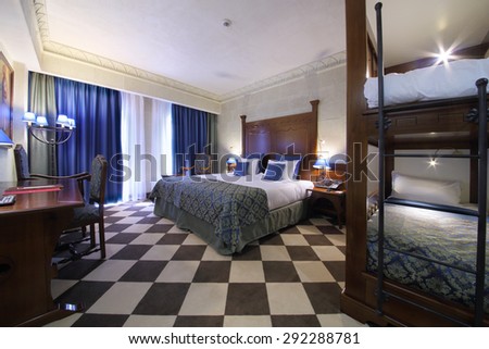 SOCHI, RUSSIA - JUL 27, 2014: Double family superior room with a double bed and a bunk bed in the Hotel Bogatyr
