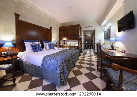 SOCHI, RUSSIA - JUL 27, 2014: Interior of double family superior room with a double bed and a bunk bed in the Hotel Bogatyr