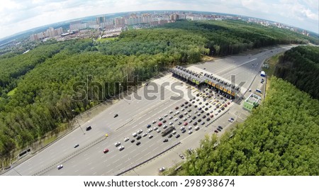 RUSSIA, MOSCOW - JUL 5, 2014: Cityscape with traffic on road at summer day. Aerial view. Photo with noise from action camera. Photo with noise from action camera