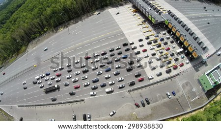 RUSSIA, MOSCOW - JUL 5, 2014: Top view of transport traffic on chargeable road. Aerial view. Photo with noise from action camera. Photo with noise from action camera