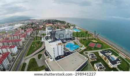 RUSSIA, SOCHI - JUL 26, 2014: Town-hotel Barhatnye Sezony and hotel Radisson Blu at summer evening. Aerial view. Photo with noise from action camera.