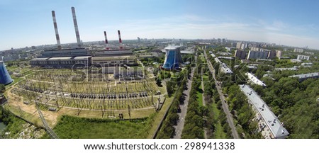 RUSSIA, MOSCOW - JUL 14, 2014: Electric power station in city. Aerial view. Photo with noise from action camera.