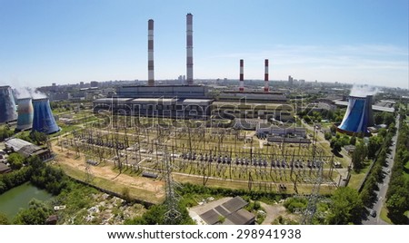 RUSSIA, MOSCOW - JUL 14, 2014: Townscape with electricity station at summer sunny day. Aerial view. Photo with noise from action camera.