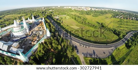 RUSSIA, MOSCOW - JUL 12, 2014: Panorama of renovation of New-Jerusalem Monastery and Christ Resurrection Cathedral at summer sunny day. Aerial view (Photo with noise from action camera)