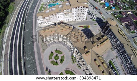 SOCHI, RUSSIA - AUG 3, 2014: Top of view Apartments hotel in ski resort of Gorki Gorod in Krasnaya Polyana, aerial view