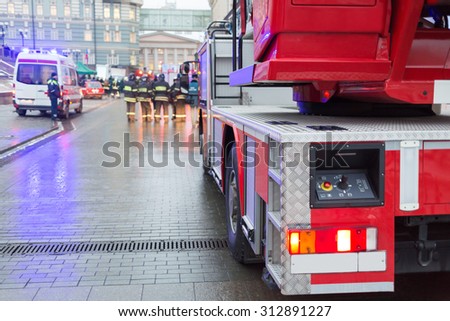 MOSCOW - December 8, 2014: Control panel of a fire truck ladder and firemen