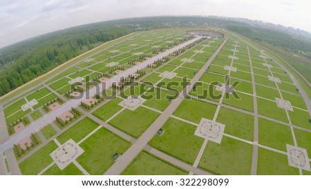Large territory of Federal Memorial Cemetery at spring cloudy day. Aerial view video frame