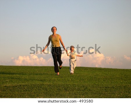 running mother with son