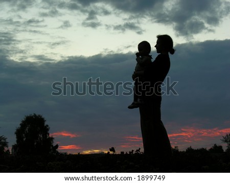 silhouette mother with baby