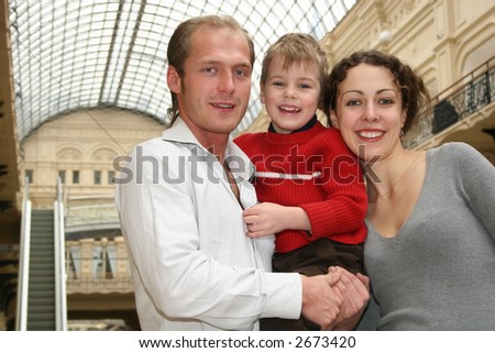 family with child in shop