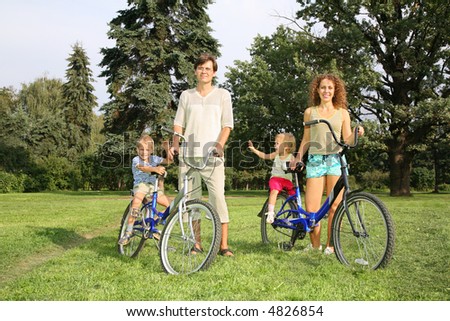 family of four with bikes