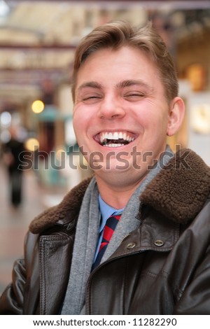 laughing man in leather jacket