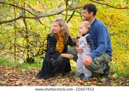 profile family with boy in autumn park