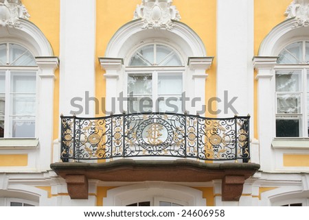 Baroque balcony on  facade of house. Peterhof. Russia.