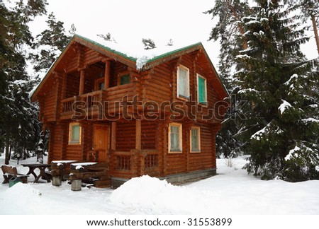 Wooden cottage in winter wood
