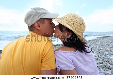 kissing pair on beach