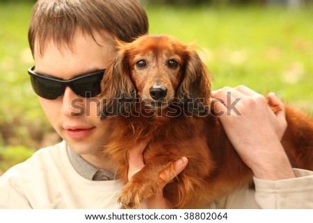 blind young man with dog-guide