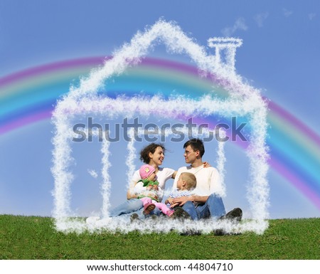 family of four sitting in dream house and rainbow collage