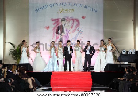 MOSCOW - FEBRUARY 14: Models wear wedding dress standing on stage at evening of French fashion in jewelry salon Estet, on February 14, 2011 in Moscow, Russia. Jewelry House Estet was founded in 1991.