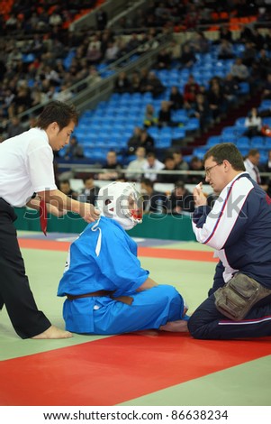 MOSCOW - FEBRUARY 19: Medic assisted wounded fighter at World Cup 2011 KUDO in Olympiysky Sports Complex, on February 19, 2011 in Moscow, Russia. Fighter Zivic from Russia.