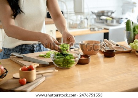 Similar – Image, Stock Photo Crop woman with slice of lemon