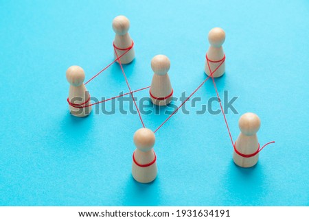 Communication between people. The figures are tied with a red thread. spreading rumors.