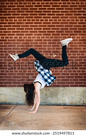 Similar – Image, Stock Photo Flexible female dancer doing splits in studio