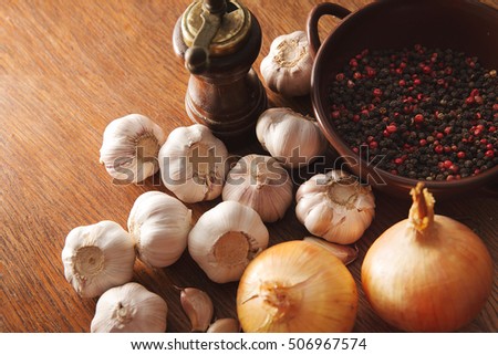 onions, cal, black pepper and red dots lie on the wooden oak table Stock fotó © 