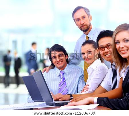 Group of happy business colleague in a meeting together at office