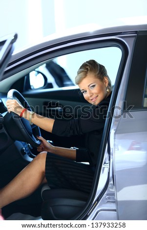 Woman buying a new car