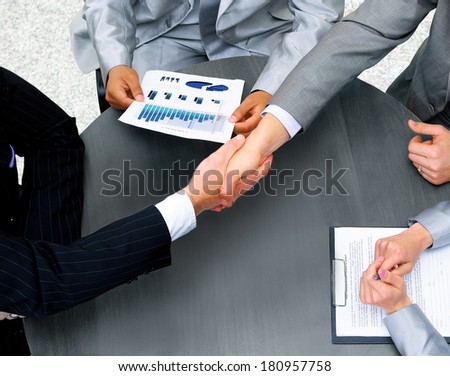 Businessmen shaking hands. Top View