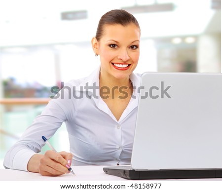 Young business woman on a laptop - isolated on white