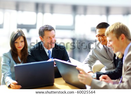 Business meeting -  manager discussing work with his colleagues