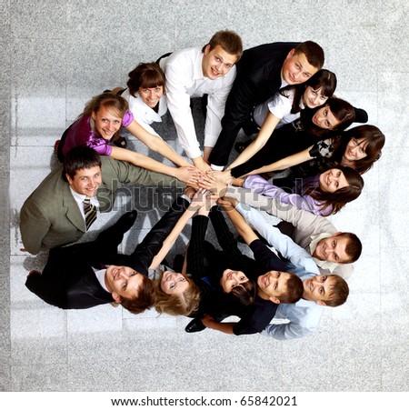 Top view of business people with their hands together in a circle
