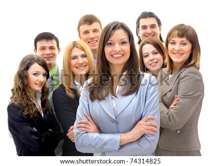Happy young business woman standing in front of her team