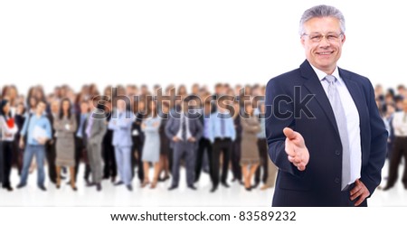 attractive business man with open hand - the elite business team