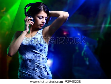 beautiful woman dj with headphones