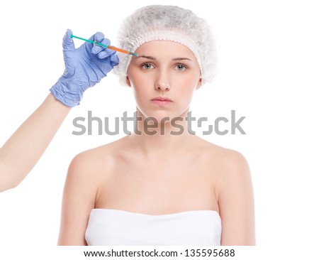 Cosmetic botox injection in the female face. Eye and eyebrow zone. Isolated on white