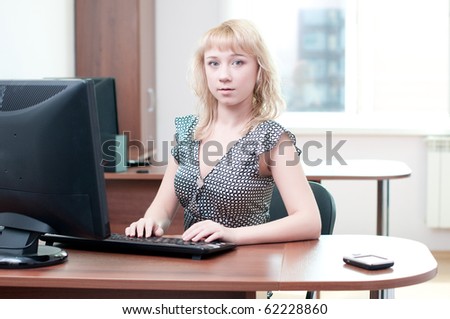 Closeup portrait of cute young business woman working with computer