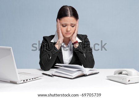 Sad business woman in office working with white table, laptop and diary personal organizer. Problem!