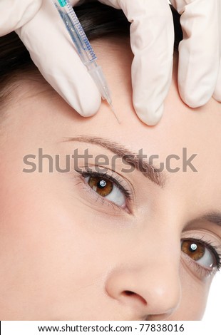 Cosmetic injection in the female face. Eyebrow zone. Isolated