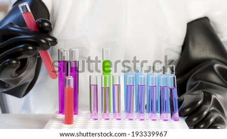 detail of woman with test tubes in laboratory