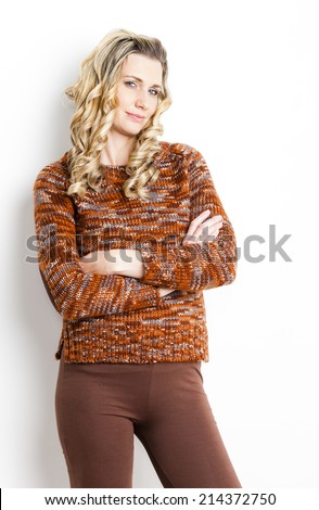 portrait of standing woman wearing brown clothes